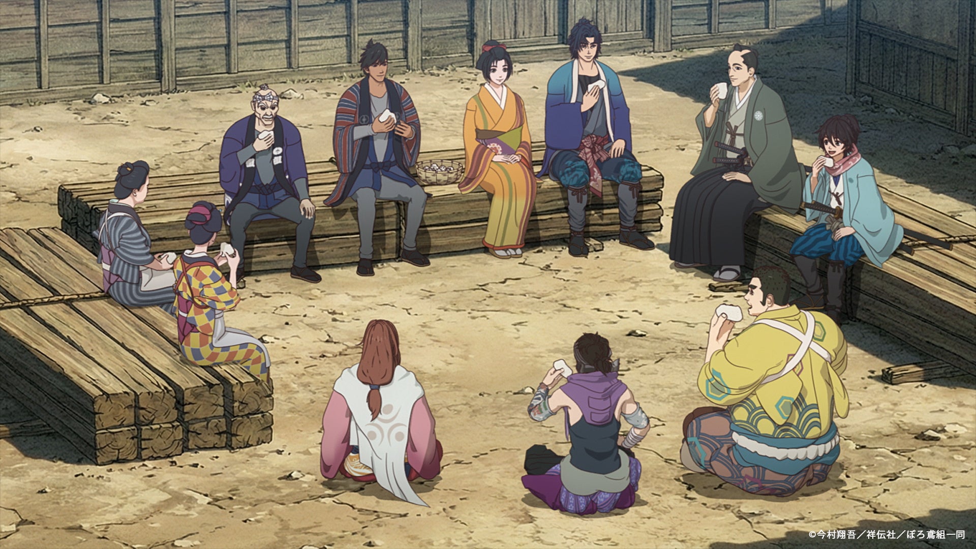 仲間たちが屋外で和やかに休憩するシーン