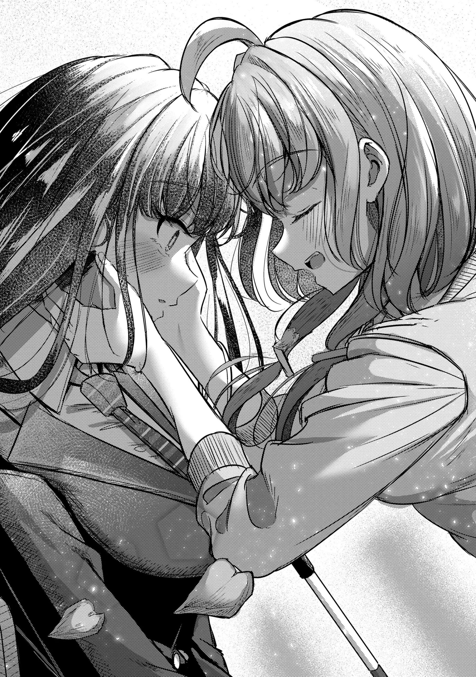 二人の女子高生が親密に寄り添う