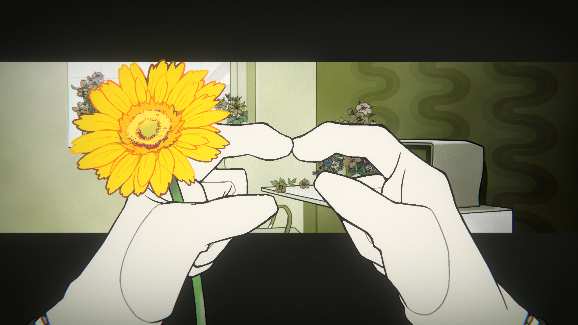 手で持つ黄色い花と部屋の背景